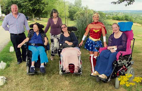 Wonder Woman accepts cheque from care home
