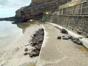 Warning to public as loose rocks pile up
