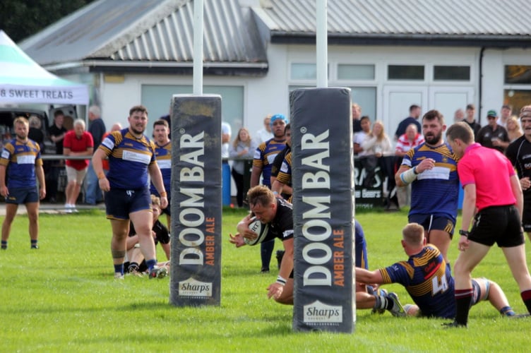 Launceston fly-half Glenn Coles scores during Saturday’s 36-22 victory over Old Centralians at Polson Bridge on Saturday. Picture: Paul Hamlyn
