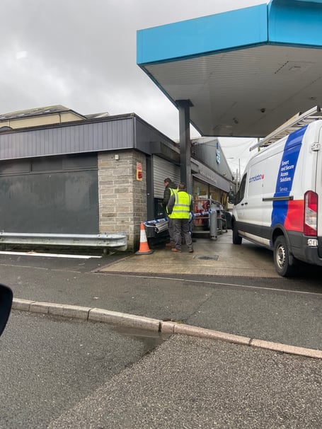 The damage being assessed at the Co-op garage on Woburn Road, Launceston