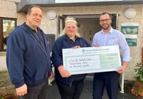 Care home make financial donation to health charity