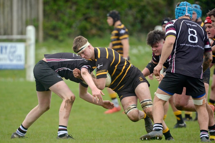 Joe Maunder (St Austell) of Cornwall U20s is tackled by Seth Marshall (St Bernadettes) of Somerset U20s. - Photo mandatory by-line: ©Simon Bryant/Iktis Photo - 23/04/23, Cornwall U20s, Somerset U20s, Jason Leonard Cup, CRFU, Sport, Rugby Union, Camborne, Recreation Ground, Cornwall, England