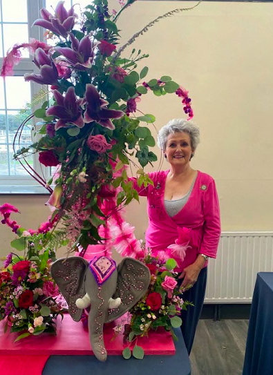Susan Griffiths with her pink creation at Bude flower club