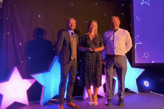 Jo Vine at Kernow House in Launceston receiving her award with Michael Beresford, head of learning programmes and Pete Calveley, CEO