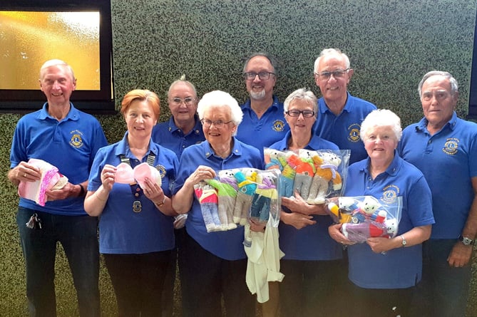 Launceston Lions displaying some of their knitted goodies