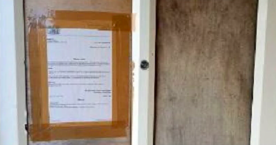 THE boarded up door at the property in Bodmin. 