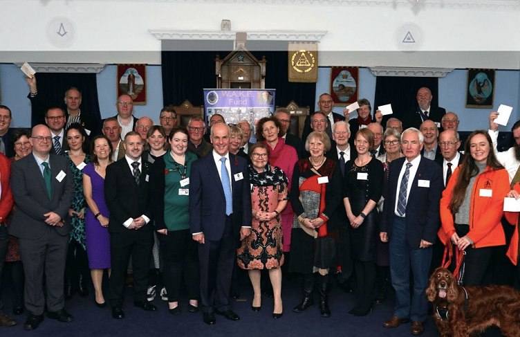 The recipients of funding are pictured receiving their cheques