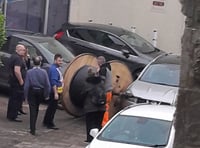 Cars damaged after large wire reel escapes trailer in Bodmin