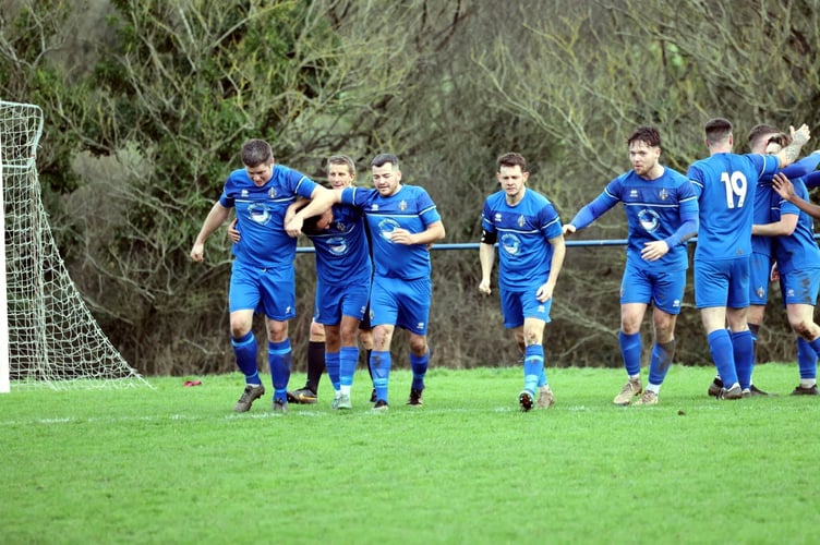 Bude Town celebrate the only goal of their Boxing Day derby victory over Holsworthy.
