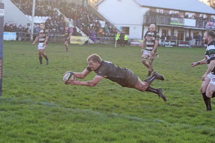 Cam Fogden dives over for Launceston's third try against Matson on Saturday.