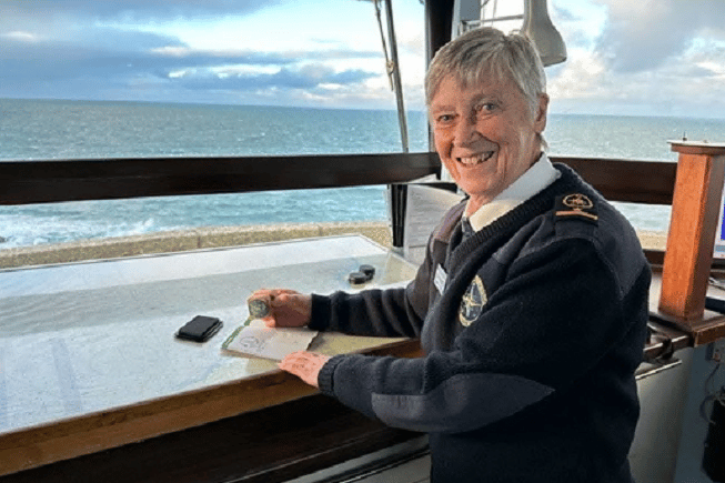 Helen at St Ives NCI station stamping the Coast Path Passport