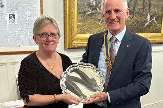 Deacon Debbie Marsh receiving The Eric Chadd Award from president Bude Rotary Club president Rob Cox