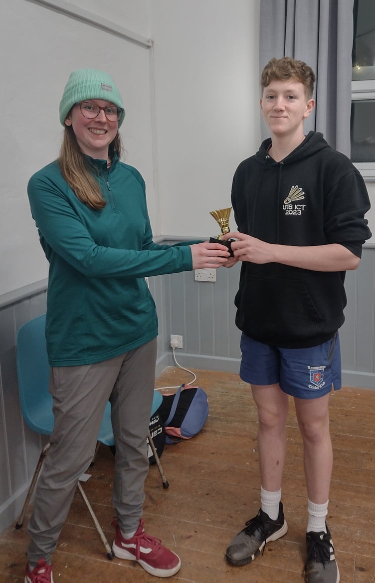 Finlay Worth being presented with his trophy by Lucy Ridgman.