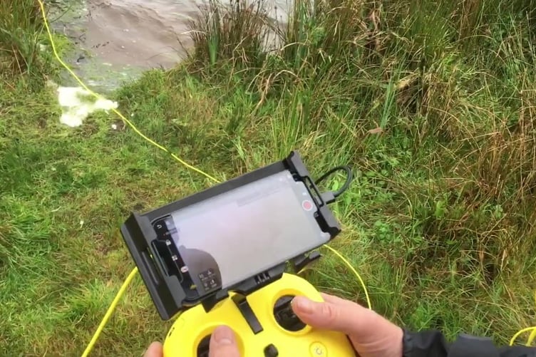 The Northants Magnet Fishing at work. Photo released April 3 2024. A team of filmmakers, magnet fishers, tech experts and divers have embarked on an outrageous quest to find - the magical sword called Excalibur.The group are searching British lakes to locate the blade said to have been thrown into the water by King Arthur.They say they have identified several possible locations of Excalibur in Britain and trying to find it for part of a new TV series called Weird Britain.Underwater camera operators, drone experts and amphibious archaeologists have joined the hunt for the mythical sword.
