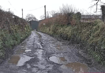 Community fight for repairs to 'dire' road littered with potholes