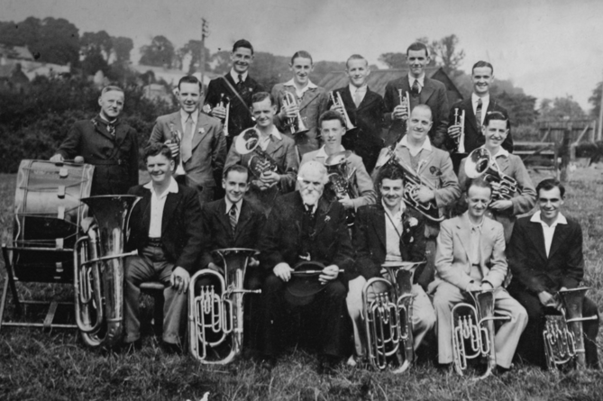 THE Post is grateful to Chris Wonnacott for supplying this photograph of Stratton Band in 1938. Pictured (back row) D Davey, S Cobbledick, C Crowell, B Jewell, S Wonnacott; (middle row) C Davey, B Ford, C Colwill, ? Joliffe, A Bissat, S Ford; (front row) F Dymond, G Colwill, ? Rattenbury, B Cann, A Parnacott, B Wonnacott. Chris said: "This 1938 photo - of Stratton Band - includes my father (Samuel Albert Wonnacott  - back row - far right) who as you can see played cornet. I followed in my fathers footsteps - also playing cornet in the 1960s, for what was then known as “Stratton Town Silver Band” - when the Bandmaster was Walter Parnell.
During the summer months, we often paraded through Stratton streets playing the Floral Dance - followed by locals and visitors enjoying joining in to dance, behind the band. I would be interested to know if anyone has a photograph of the 1960s band I played in, as I do not have any, and would like to get hold of a copy, if one exists. Enjoy your trip back to 'Times Past'." Do any of our readers recognise those pictured?