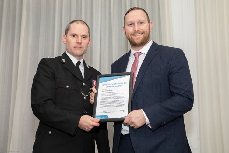 RYAN Hammond being presented with his bravery award by Chief Superintendent Matt Longman