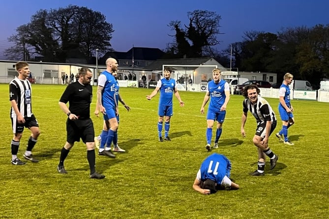 Ben Collins riles in pain after a late challenge from Holsworthy midfielder Jack Tribble. Picture: Kevin Marriott