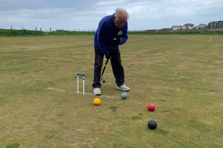 One of Bude's players prepares to take a shot.