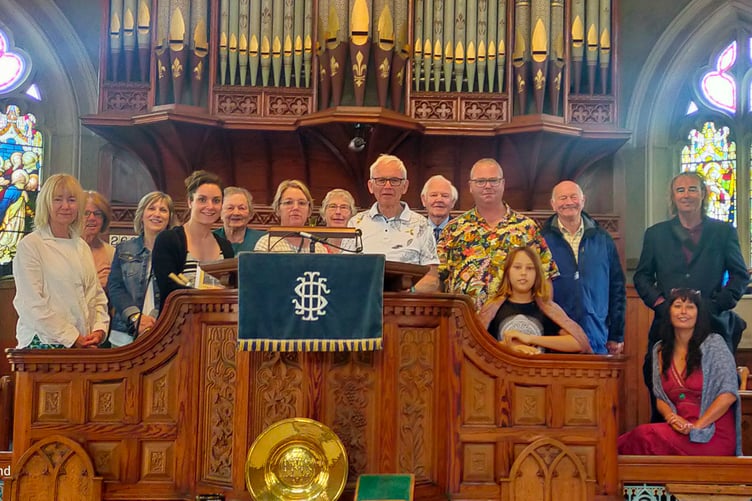 Descendants of the Holsworthy Carthews and their partners visit Holsworthy Methodist Church: the organiser of the family reunion, Rob Carthew, grandson of George T Carthew, is in the centre in a white shirt, along with family members and Bodmin Street friends.