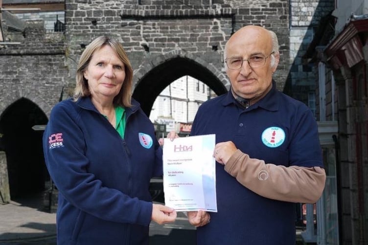Jill Bright presenting Kevin Wadland with a certificate for 40 years service