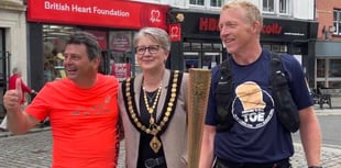 Town visited by Olympic torch for ultra marathon charity challenge