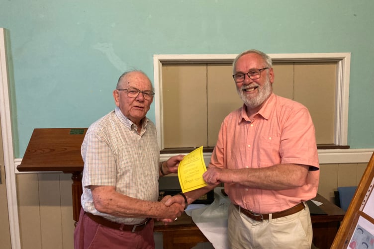 Viv Sandercock chairman of the club presenting Neil with a Certificate of the Club’s appreciation for displaying at Launceston