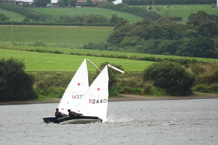 Nathan and James Pollard in Laser 4.7s compete against each other in tempestuous conditions. Picture: Mandy Pollard