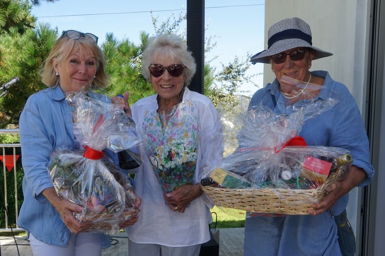 Busy running the raffle stall are Virginia, Janie and Jennie. (Picture: Adrian Jasper)