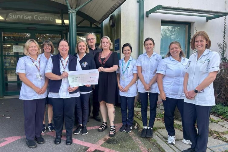 Alstock Team members Kelly Dowrick and Keith Vingoe alongside staff from the Sunrise Centre.