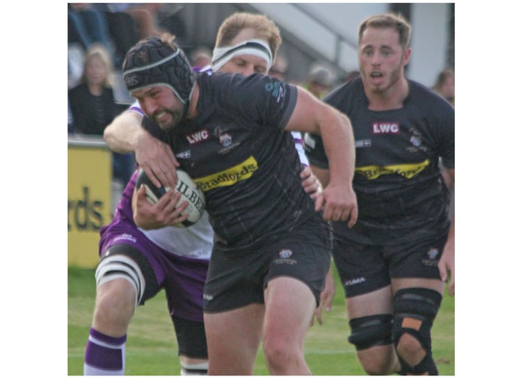 Flanker Lloyd Duke drives forward under pressure from the Exmouth defence. Picture: Paul Hamlyn