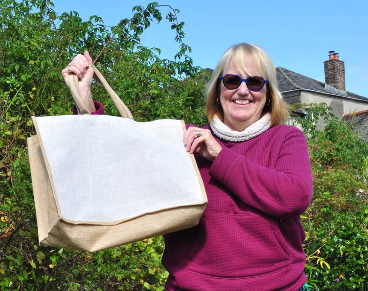 Marian Southwick with one of the tote bags