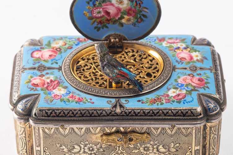 A Swiss singing bird automaton music box being offered