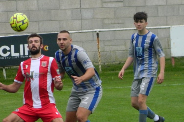 Gavin Carter keeps an eye on Newquay's Tom Shepherd as full-back Callum Martyn watches on. Picture: Steve Pearce