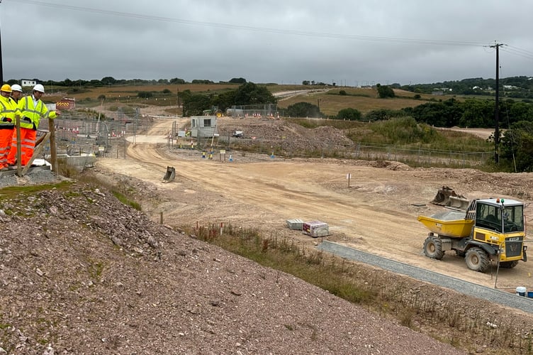 Treveth's Harry Lewis, Cormac's Steve Worthington and Cornwall councillor Olly Monk survey work being carried out to construct the new Northern Access Road at Langarth (Picture: LDRS)