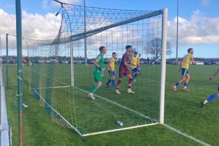 Mark Elvidge, pictured centre of goal, looks to make life uncomfortable for home keeper Ethan Elwell at Sticker on Saturday. Picture: Launceston AFC