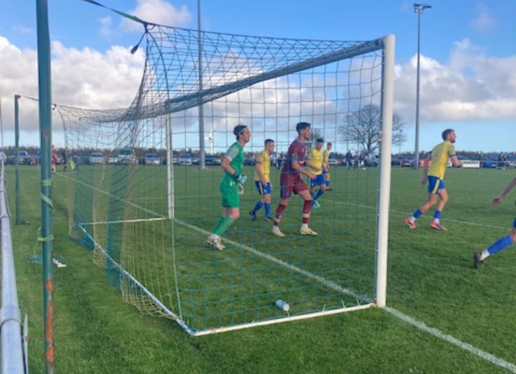 Mark Elvidge, pictured centre of goal, looks to make life uncomfortable for home keeper Ethan Elwell at Sticker on Saturday. Picture: Launceston AFC