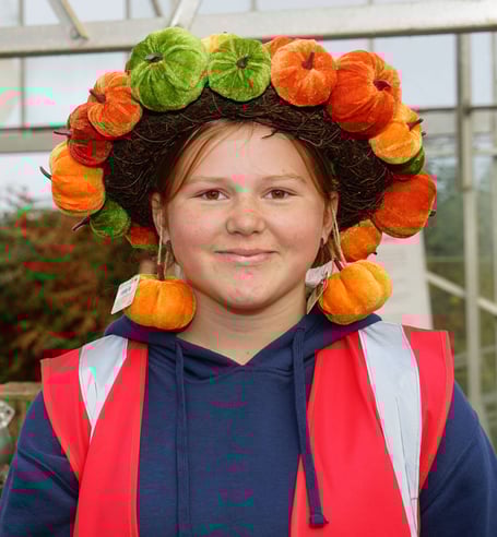 A smile from Ruby  of Crdar Croft Nurseries proudly wears her pumpkin crown                