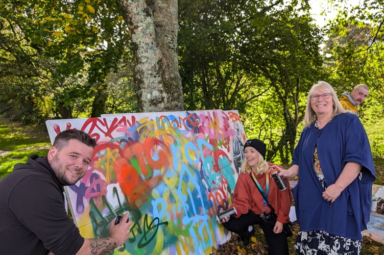 A mayor resorting to graffiti isn't a sight that's common, but Cllr Liz Ahearn joined KBSK founder Adie Dove and volunteer Adam Swatton in adding to the decorations on the graffiti board. (Picture: Aaron Greenaway)