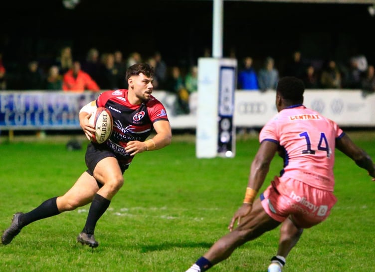 Pirates' replacement fly-half Iwan Jenkins is opposed by Exeter's hat-trick scoring wing Paul Brown-Bampoe. Picture: Brian Tempest