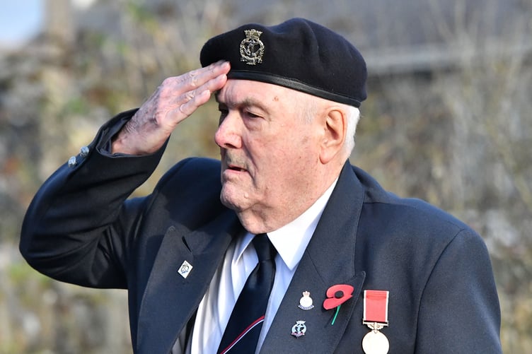 Chris Hore takes the salute after laying the wreath on behalf of The Royal Naval Association (Picture: Adrian Jasper)
