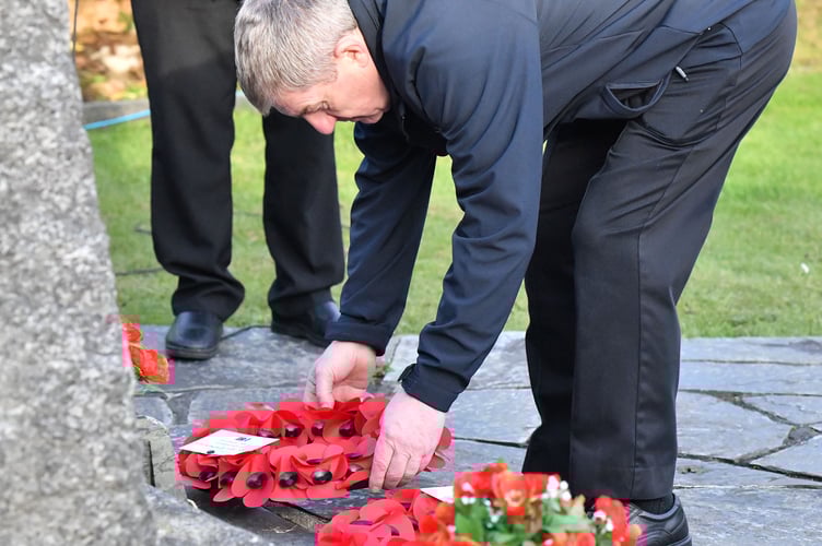 Richard Bluett lays a wreath on behalf of the Delabole Fire and Rescue Service. (Picture: Adrian Jasper)