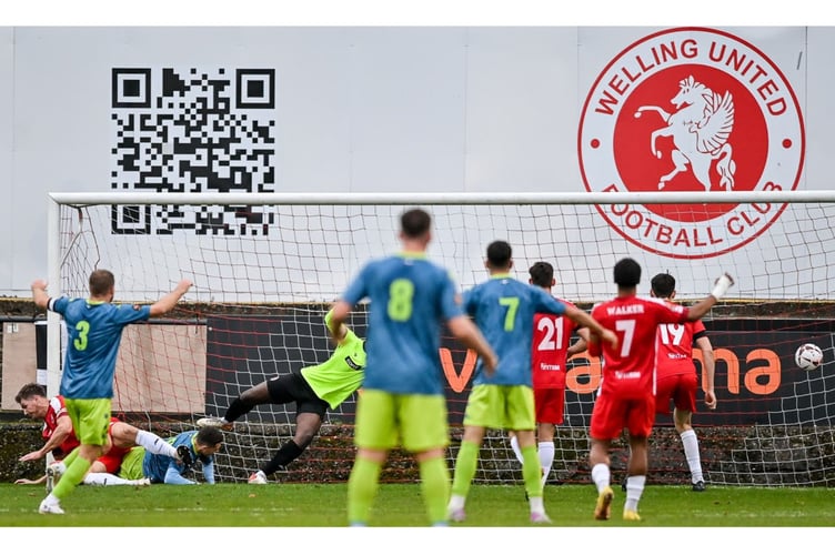 Jaze Kabia slides in to score Truro's equaliser at Welling United on Saturday. Picture: Dave Budden/Welling United