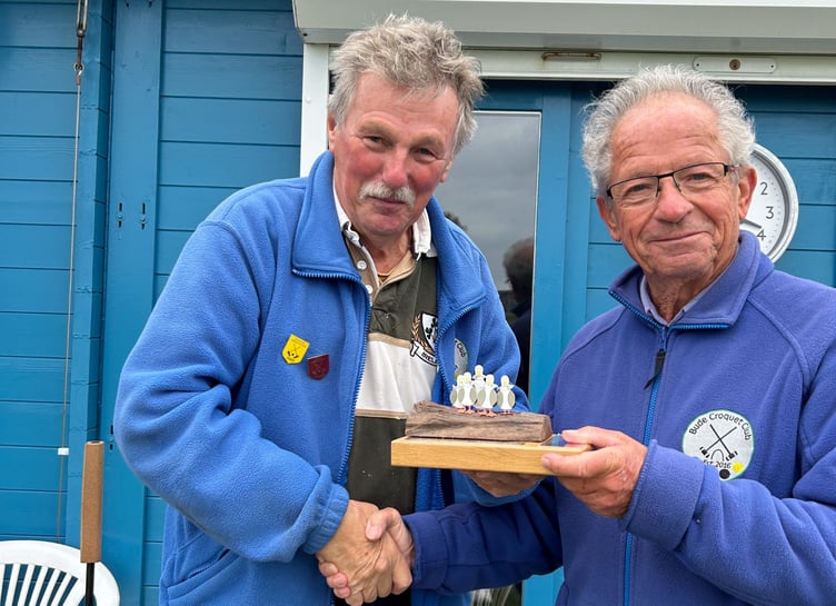 Chairman Chris Ham presents Tim Benson with the trophy. Picture: Bude Croquet Club