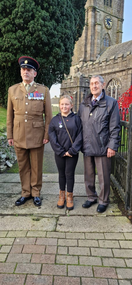 DEREK Earl with his granddaughter Taylor-May and nephew Noel at Callington's War Memorial