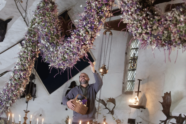 Cotehele National Trust's famous Christmas garland has been finished after weeks of hard work attaching hundreds of dried flowers.