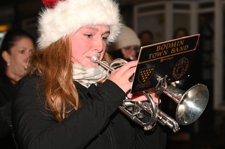 Maddie on her cornet of the Bodmin Town Band in festive style marches through the town