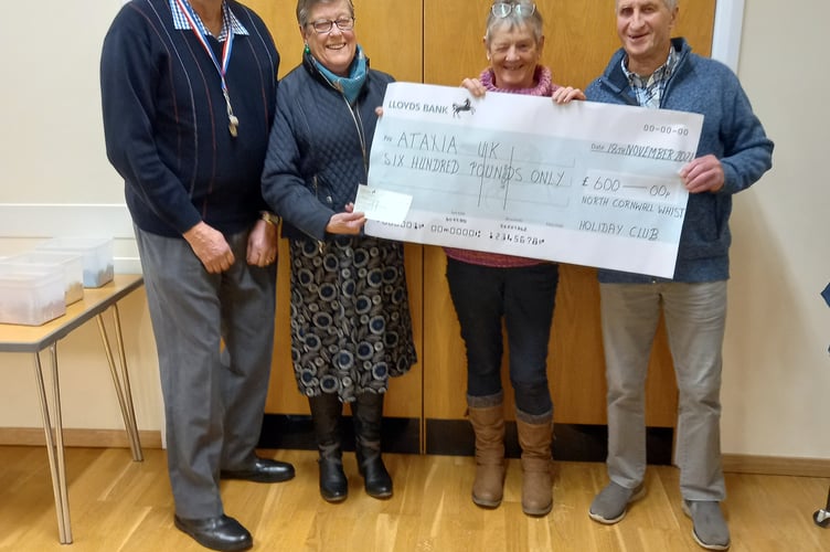 A cheque was presented to the Whist Drive's chosen charity Ataxia UK