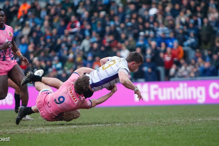 Cornish Pirates centre Tom Georgiou crosses for his side's try against the Cornish Pirates at Sandy Park