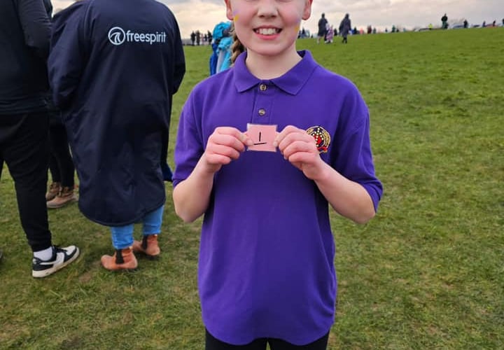 Theia Jones, working very hard to claim back 1st place in the Year 5/6 girls race for Bishop Cornish